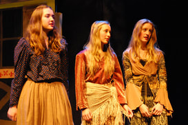 Production photo showing 3 girls in costume for Around The World in 8 Plays